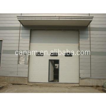 Security Sectional Steel Vertical Sliding Industrial Door with Pedestrian Door