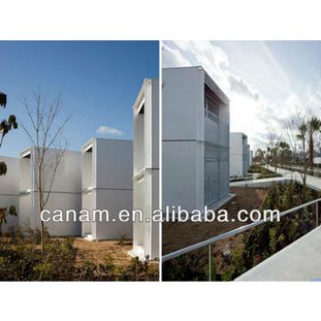CANAM- movable container building with wheel