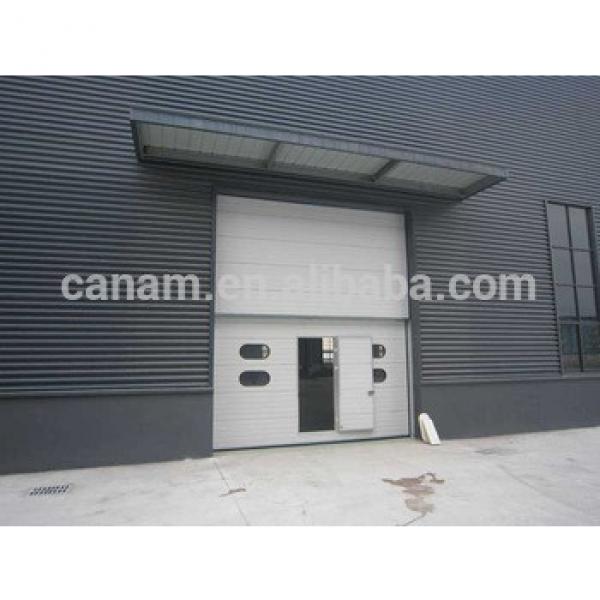 sectional garage door/industrial door with pedestrian door and windows kit #1 image